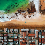rusting-old-buildings-on-a-beach-from-above-